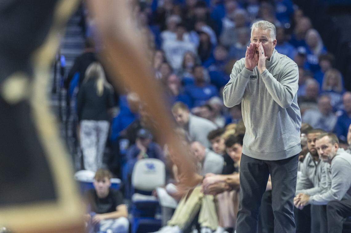 Purdue head coach Matt Painter talks to his team during Friday’s exhibition loss to Kentucky at Rupp Arena. 