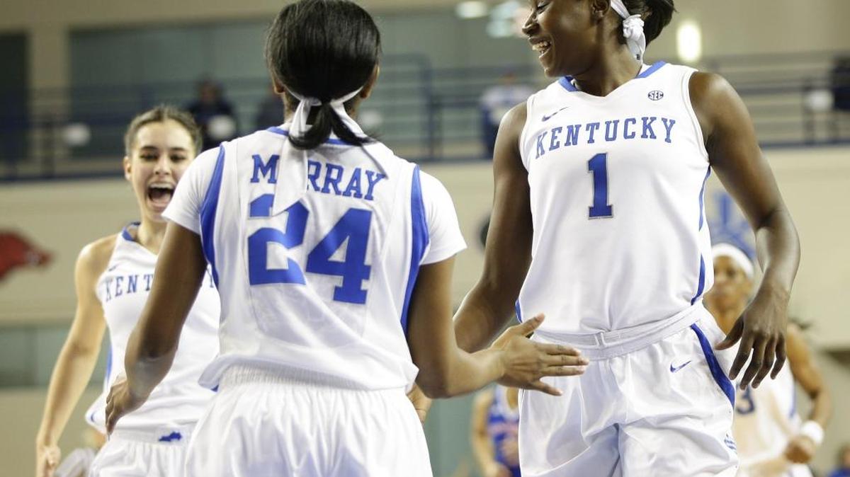 Kentucky forwards Maci Morris (4) and Batouly Camara (1) congratulated guard Taylor Murray (24) on scoring a basket during the first half on Monday, Dec. 28, 2015, in Lexington.