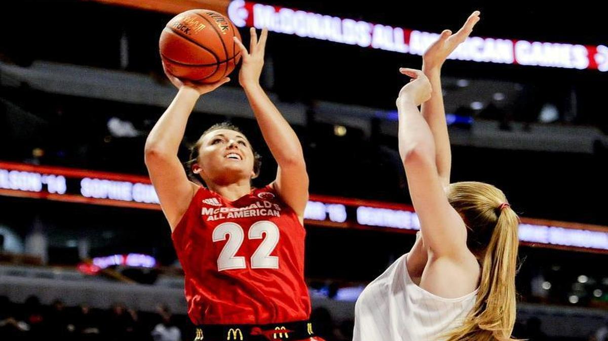 East Forward Erin Boley (22) from Elizabethtown High School in Elizabethtown, Ky., shoots past West forward Lauren Cox from Flower Mound High school in Flower Mound, Texas during the McDonald's All-American Girls basketball game, Wednesday, March 30, 2016, in Chicago. (AP Photo/Matt Marton)