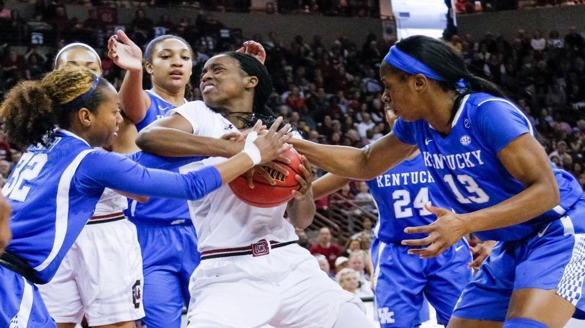 South Carolina's Kaela Davis (3) grapples for the ball with Kentucky's Jaida Roper (32) and Kentucky's Evelyn Akhator (13) during the first half of action in the Colonial Life Arena. 2/26/17