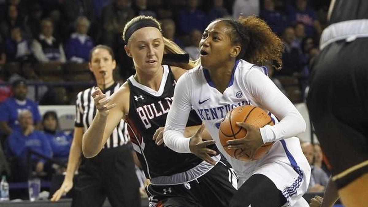 UK's Jaida Roper drives to the basket between Gardner-Webb defenders.