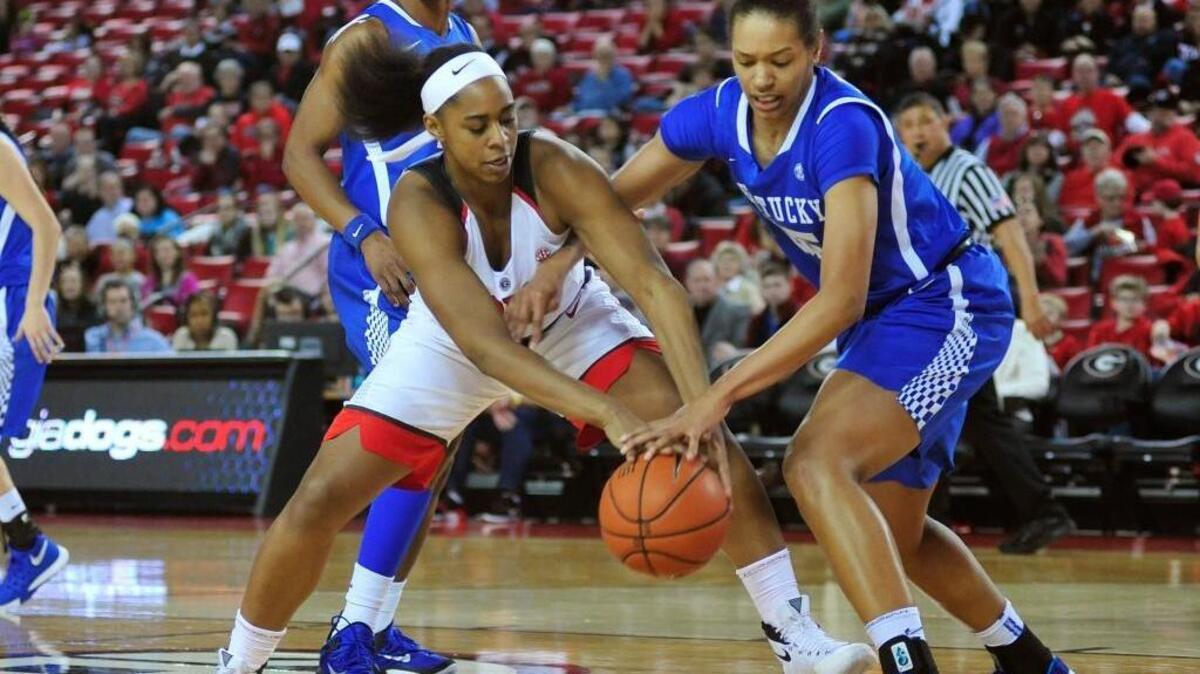 Georgia forward Halle Washington, front left, and Kentucky forward/center Alexis Jennings, front right, compete for the ball during the first half of an NCAA college basketball game Sunday, Jan. 10, 2016, in Athens, Ga.