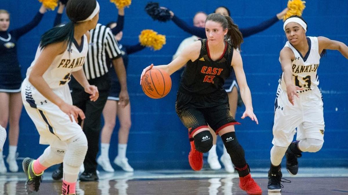 Bullitt East's Lindsey Duvall (12) drove the ball as Bullitt East defeated Franklin County 72-61 on Monday Feb. 15, 2016 in Frankfort, Ky.