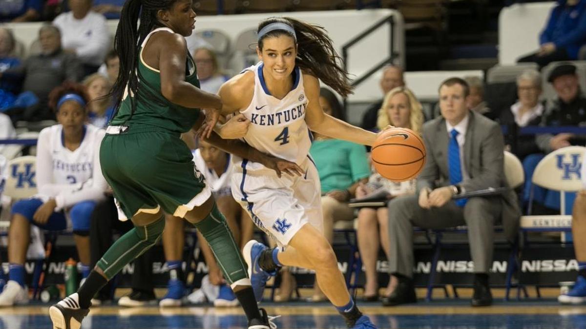 Kentucky Wildcats guard Maci Morris (4) drove past Sacramento State Hornets forward Kyhonta Doughty (30) as UK women's basketball team defeated Sacramento State 101-70 at Memorial Coliseum on Friday Nov. 10, 2017.