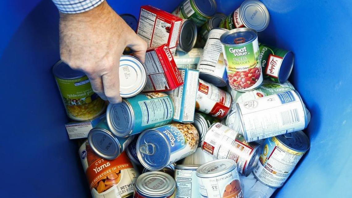 An individual with God's Pantry Food Bank sorts through donated cans of food in this 2017 file photo. Here's some organizations around Lexington that offer free food to those in need. 