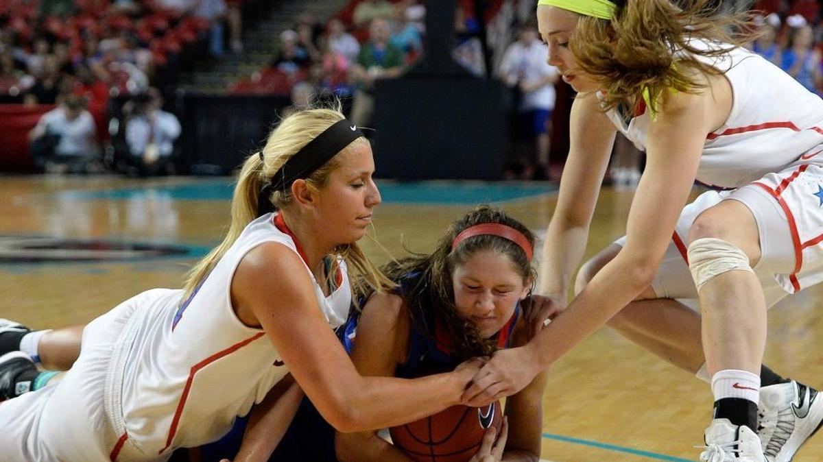 Kentucky’s Jessica Hardin, center, battles Indiana’s Rhagen Smith, left, and Bridget Perry for a loose ball during the girls game in the Kentucky-Indiana High School All-Star Classic at Freedom Hall in Louisville Friday June 14, 2013.