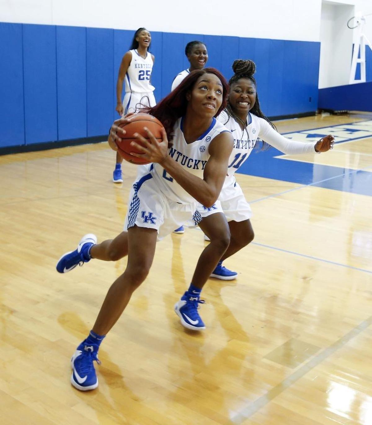 Newcomer Dorie Harrison drove past fellow freshman Kameron Roach during a UK workout on photo day.