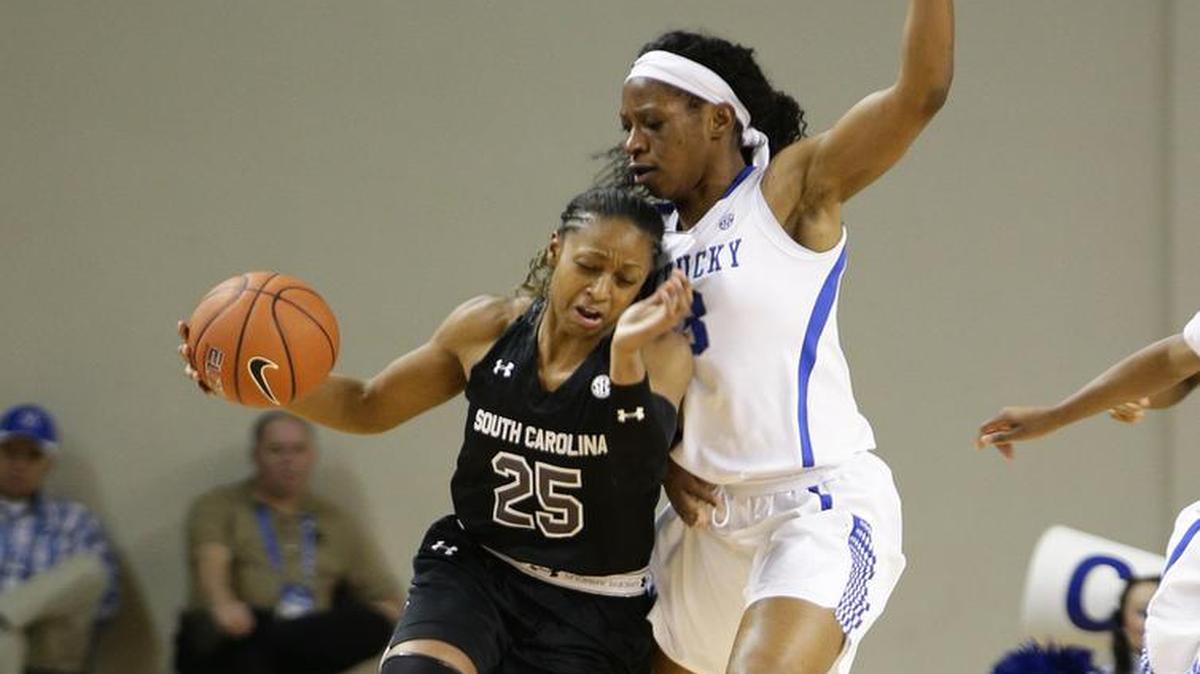 South Carolina Gamecocks guard Tiffany Mitchell (25) drew a second foul on Kentucky Wildcats forward Evelyn Akhator (13) .