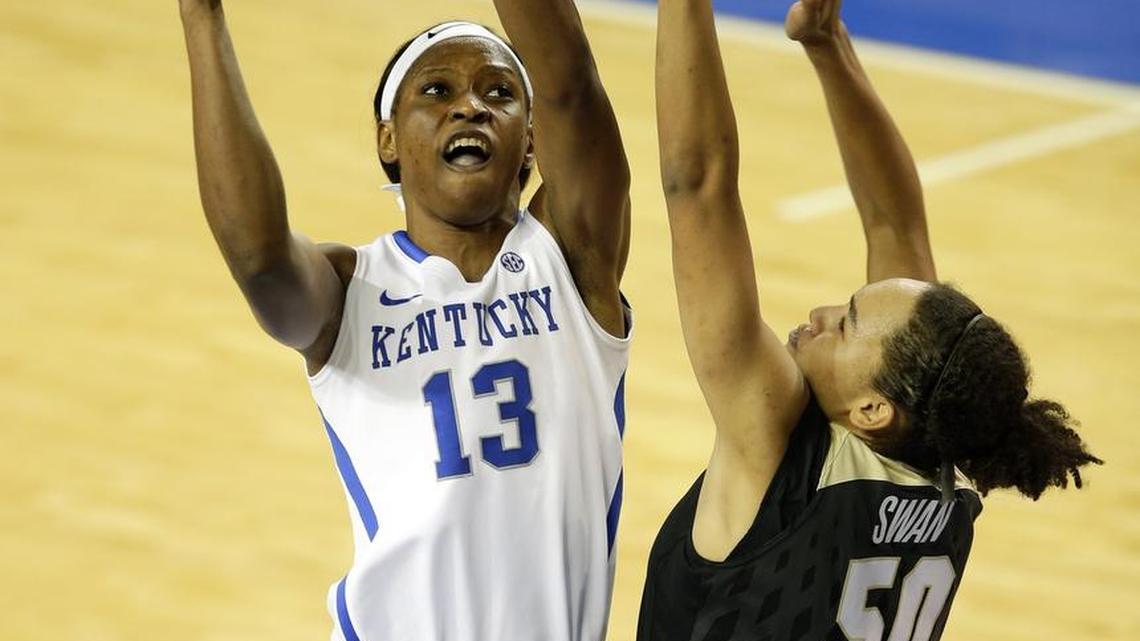 Kentucky forward Evelyn Akhator (13) shoots over Colorado forward Jamee Swan (50) during the second half at Memorial Coliseum Sunday, Nov. 22, 2015 in Lexington, Ky.
