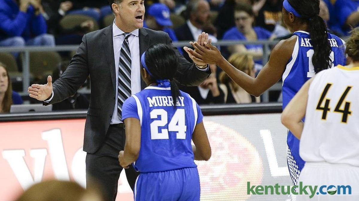 Kentucky Wildcats head coach Matthew Mitchell high fiving his team during a timeout as Kentucky defeated Northern Kentucky 84-65.