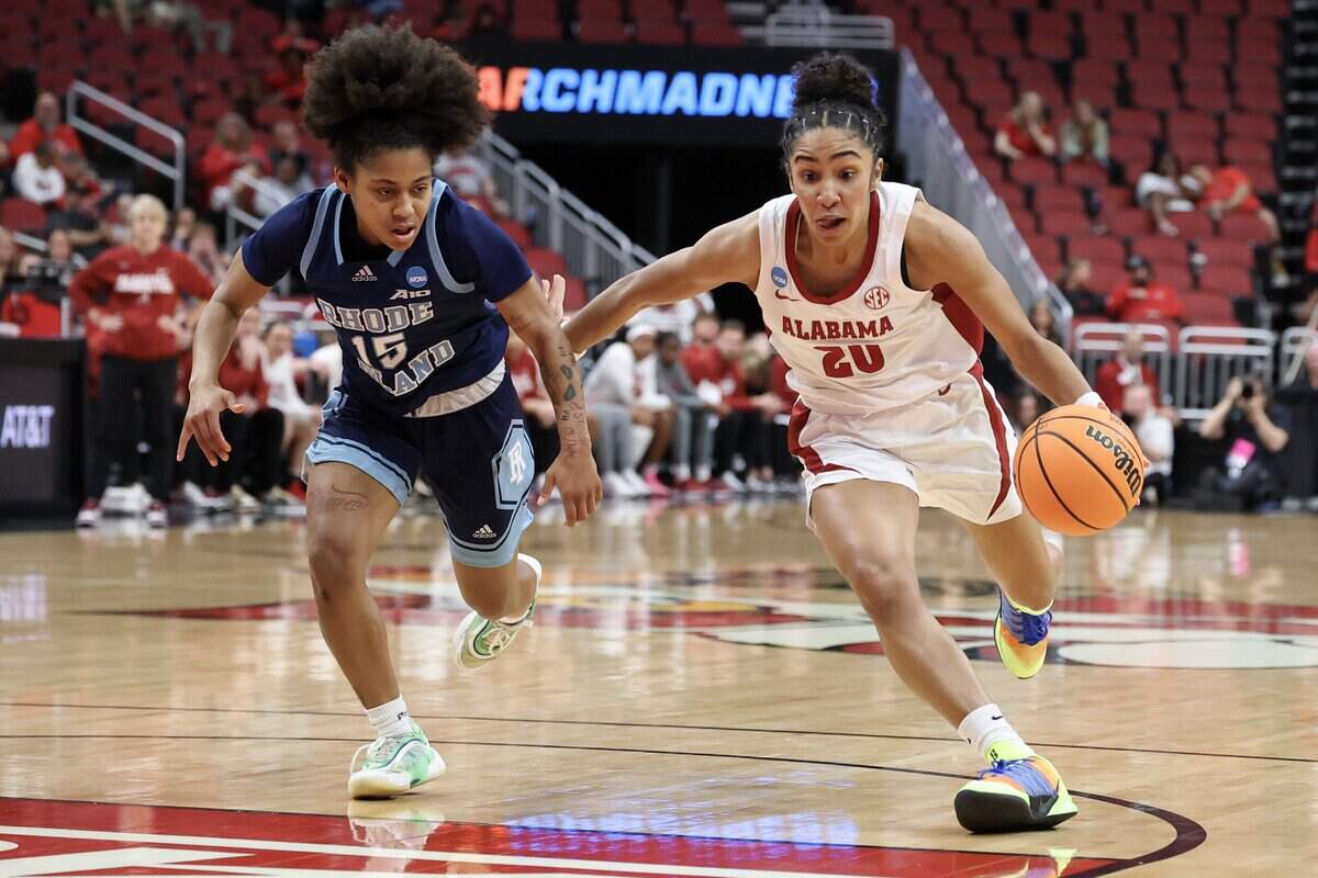 LOUISVILLE, KENTUCKY - MARCH 21: Diana Collins #20 of the Alabama Crimson Tide drives against Sophia Vital #15 of the Rhode Island Rams during the first quarter of a game in the first round of the 2026 NCAA Women's Basketball Tournament at KFC YUM! Center on March 21, 2026 in Louisville, Kentucky. (Photo by Andy Lyons/Getty Images)