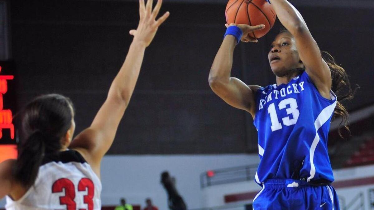 Kentucky forward Evelyn Akhator (13) shoots over Georgia forward Mackenzie Engram (33) during the first half of an NCAA college basketball game Sunday, Jan. 10, 2016, in Athens, Ga.
