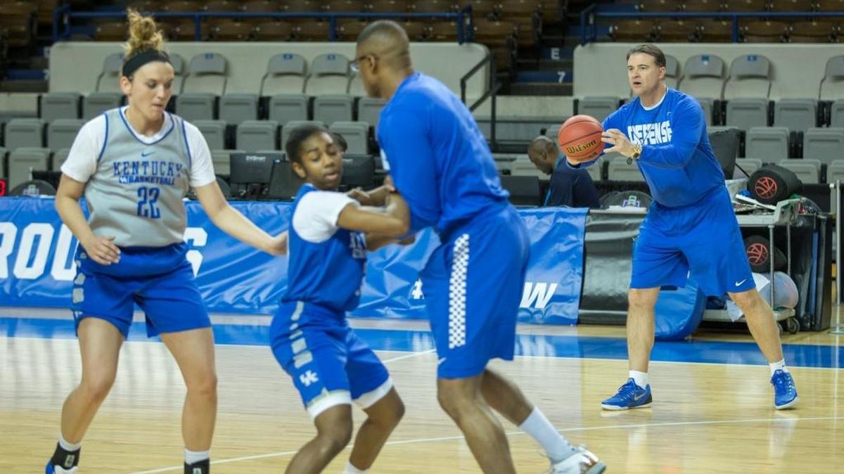 Kentucky Wildcats head coach Matthew Mitchell passed the ball during practice at Memorial Coliseum on Friday March 18, 2016 in Lexington, Ky.