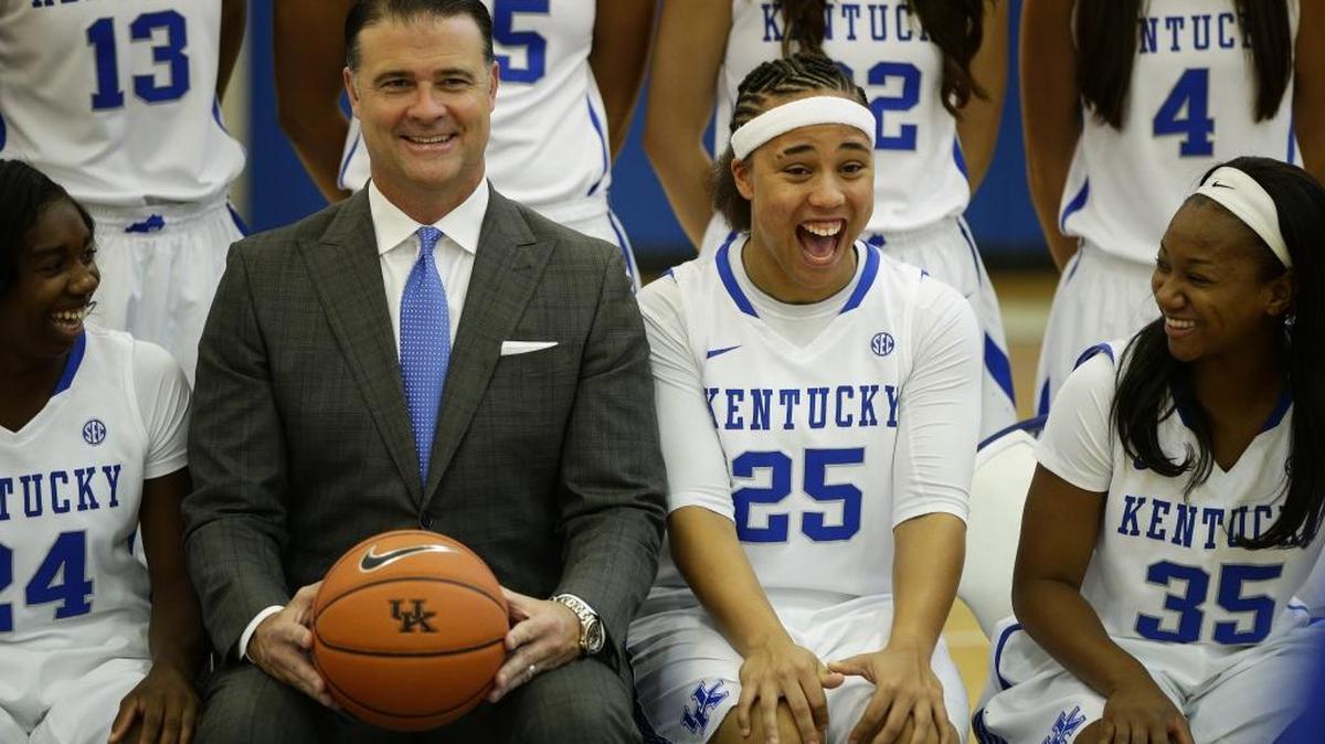 UK basketball coach Matthew Mitchell joked around with Makayla Epps (25), Taylor Murray (24) and Jaida Roper (35) during the team picture at UK’s photo day in July.