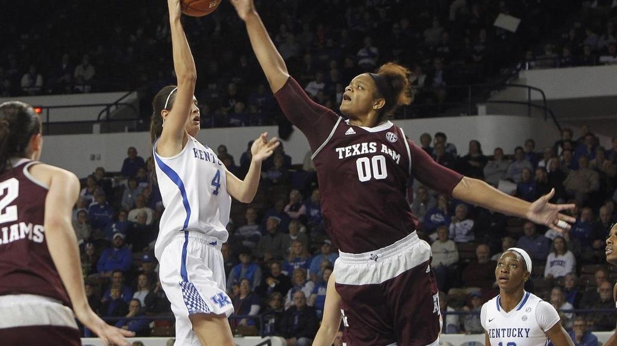 Texas A&M's Khaalia Hillsman blocked a shot by UK's Maci Morris in the third quarter as the Cats fell 77-68 at home.