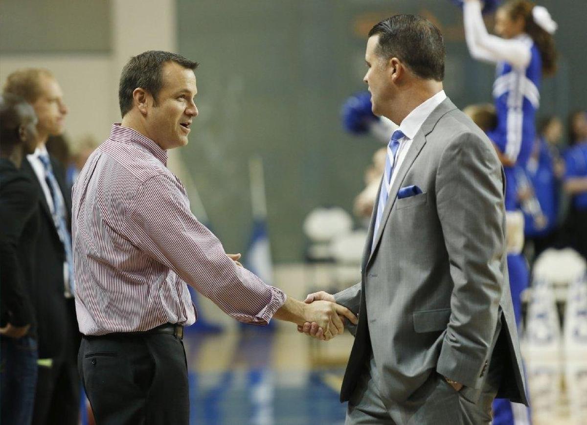 Kentucky Coach Matthew Mitchell, right, retired this past week ahead of a season that will not see a UK game against Louisville and Coach Jeff Walz, left, unless it happens in the postseason.