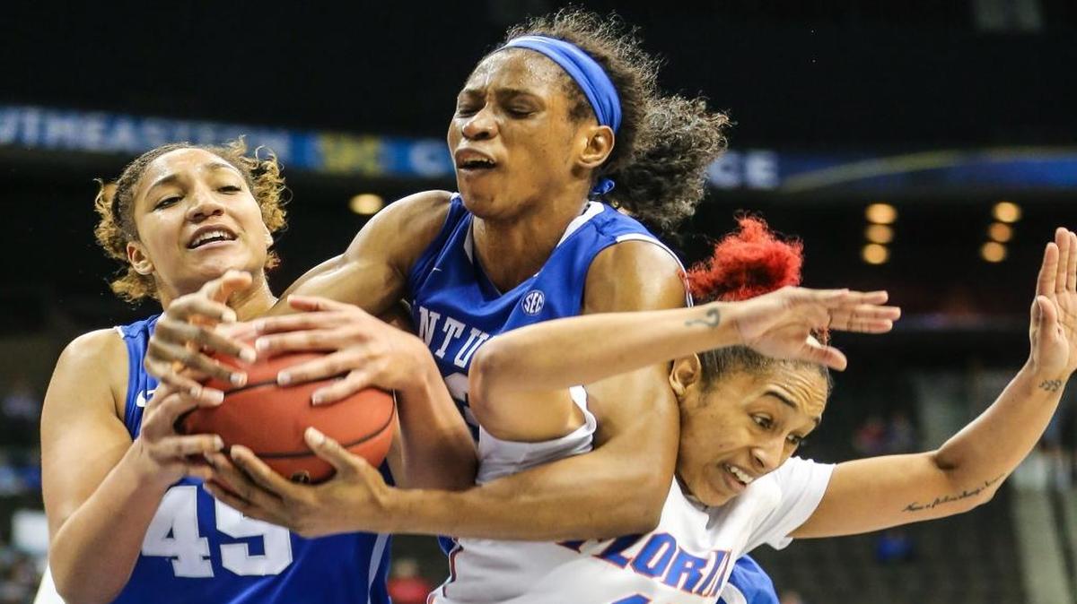 Kentucky center Alyssa Rice (45), teammate Evelyn Akhator (13) and Florida guard Cassie Peoples (13) vie for a loose ball during in the women’s Southeastern Conference Tournament in Jacksonville, Fla., on Friday, March 4, 2016.