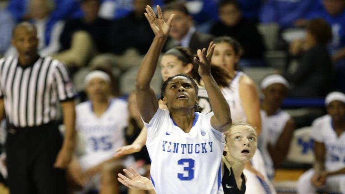 Kentucky guard Janee Thompson (3) shoots and is fouled by Colorado guard Kennedy Leonard (14) during the second half at Memorial Coliseum Sunday, Nov. 22, 2015 in Lexington, Ky.