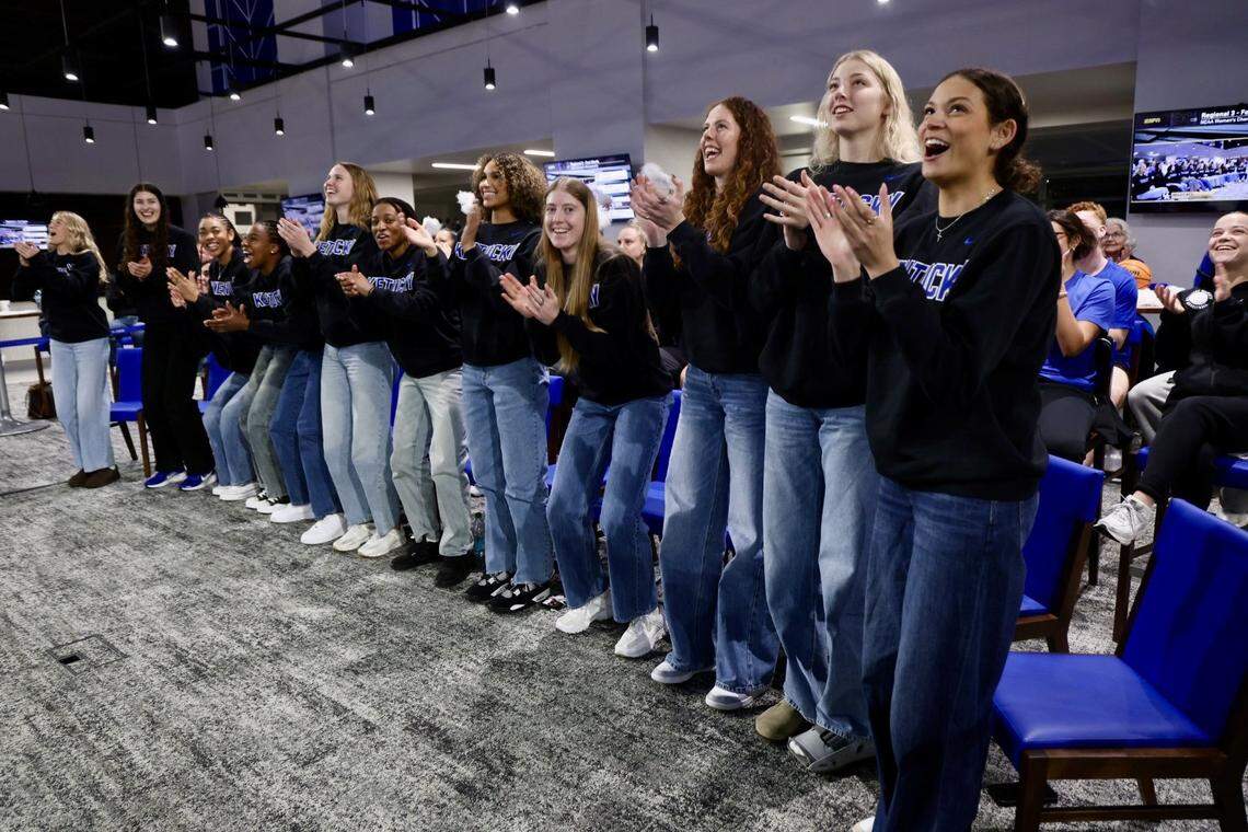Members of the Kentucky women’s basketball team react as they learn where they’ll play in the NCAA Tournament during a watch party at Memorial Coliseum on Sunday. 