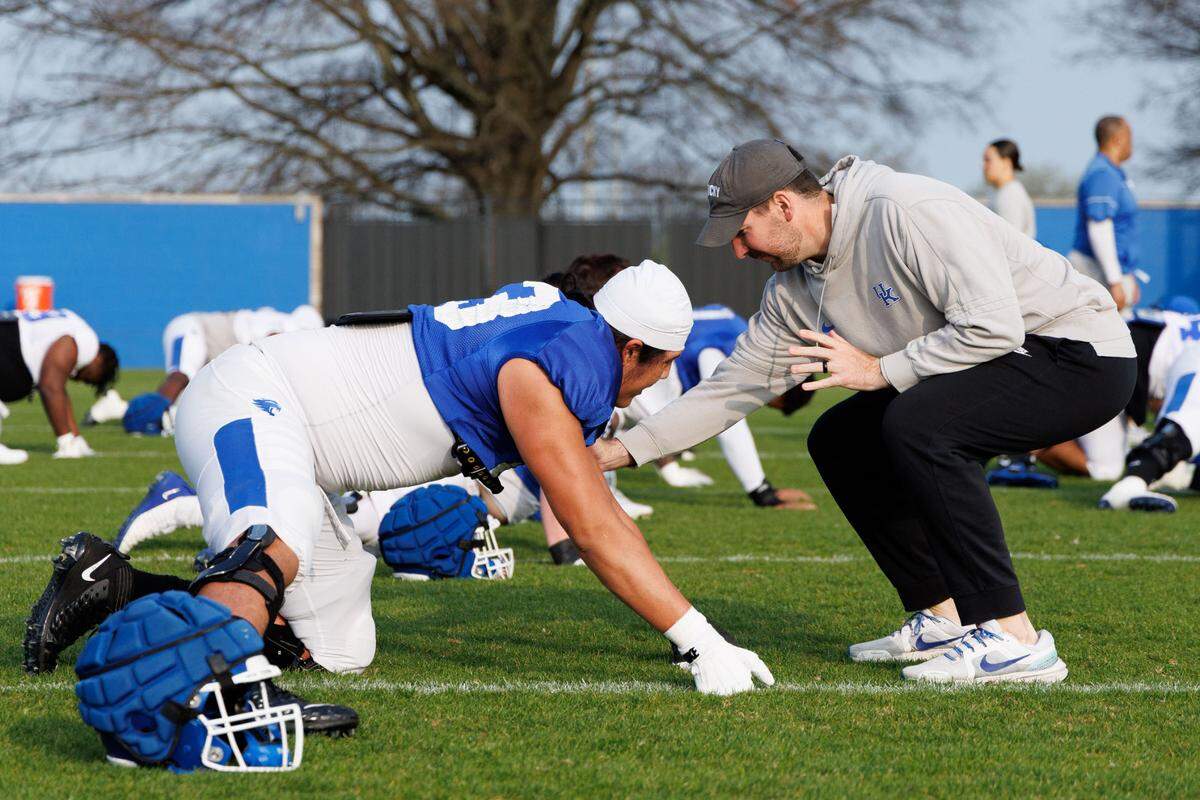 Derek Shay, right, worked with the Kentucky offensive line in his first season in Lexington as an offensive assistant in 2024.
