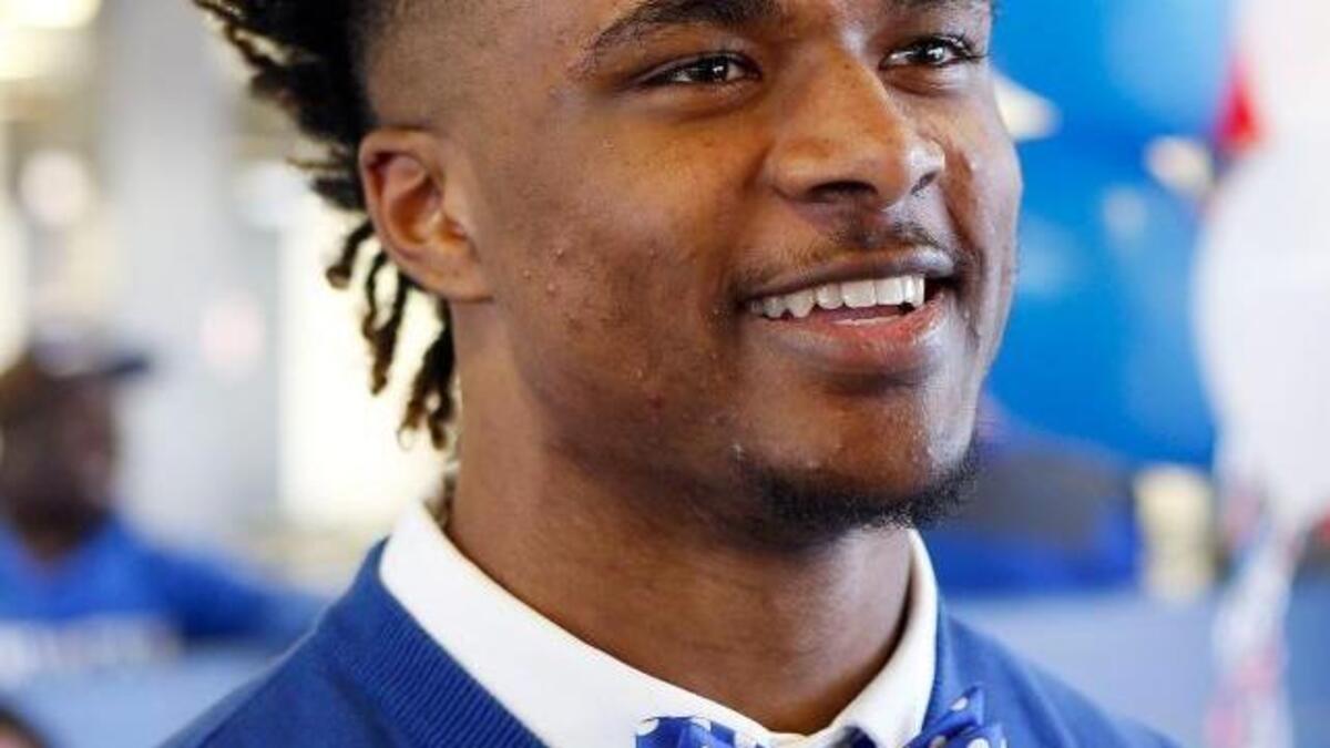 Davonte Robinson wore a blue and white bow tie to his signing ceremony when he officially joined UK’s football program in 2016..