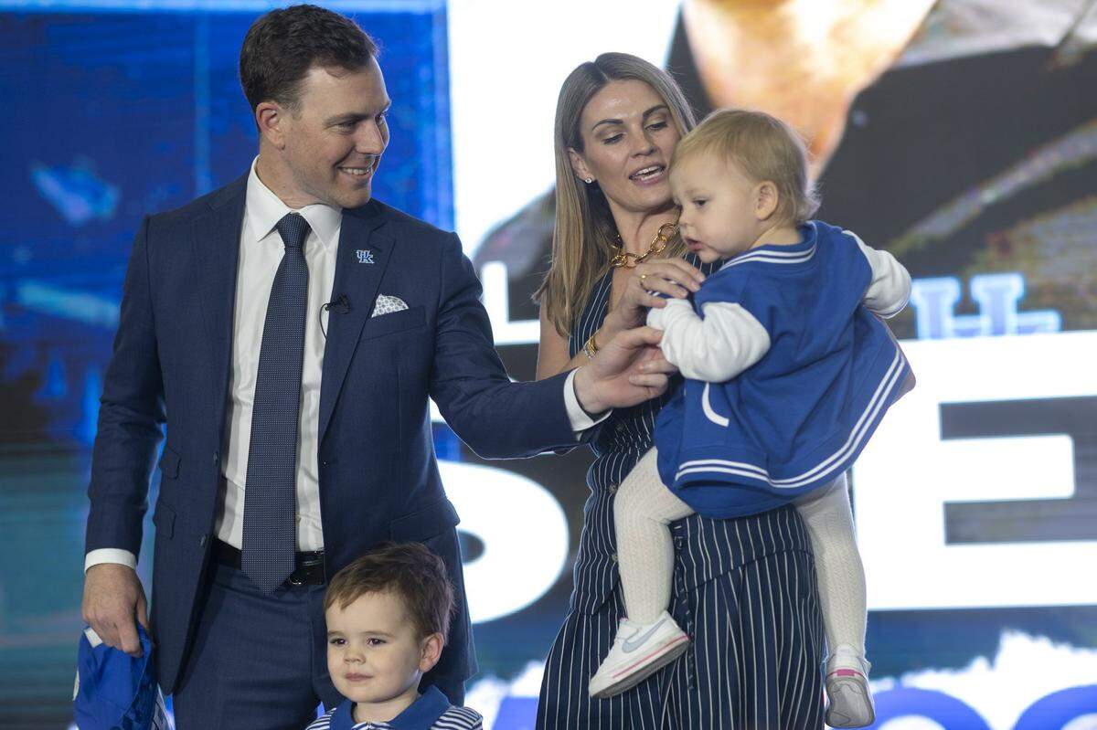 Will Stein, the new University of Kentucky head football coach, is photographed with his wife, Darby, and children, Joey and Demi, following a media conference announcing his hiring at the Nutter Field House in Lexington, Ky., on Wednesday, Dec. 3, 2025.
