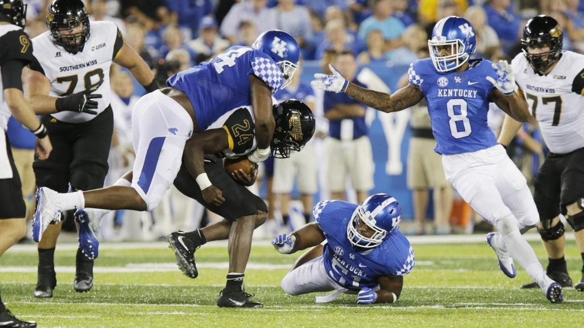 Kentucky’s Courtney Miggins tried to bring down George Payne of Southern Miss during the Wildcats’ season opener. UK gave up 500 or more yards to each of its first three opponents this season.