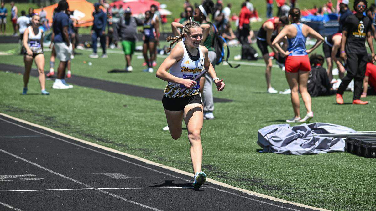 Woodford County’s Addison Moore runs her leg of the 4-by-400-meter relay at the Region 6 championship on May 17, 2025.