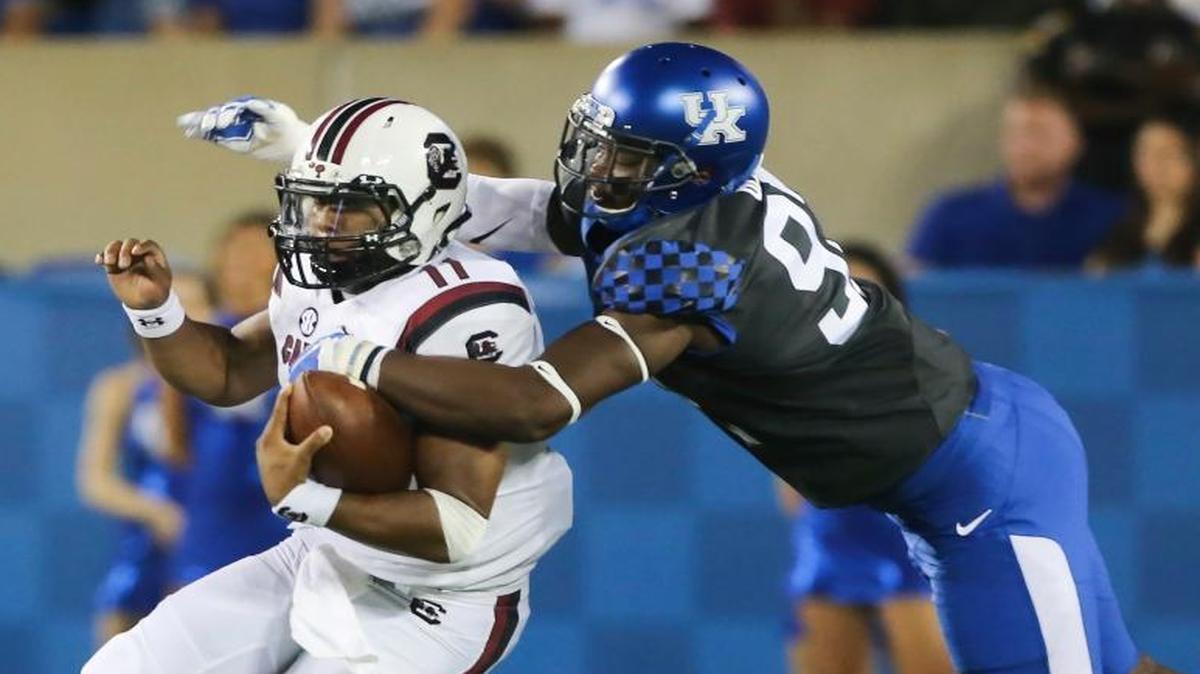 South Carolina quarterback Brandon McIlwain was tackled by Kentucky defensive end Alvonte Bell in the first half on Sept. 24, 2016, in Lexington.