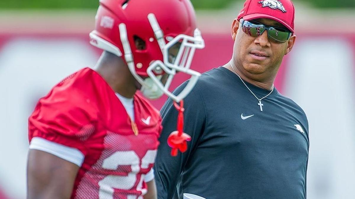 Michael Smith, right, coached wide receivers at Arkansas for five seasons and was at Kansas State before that.