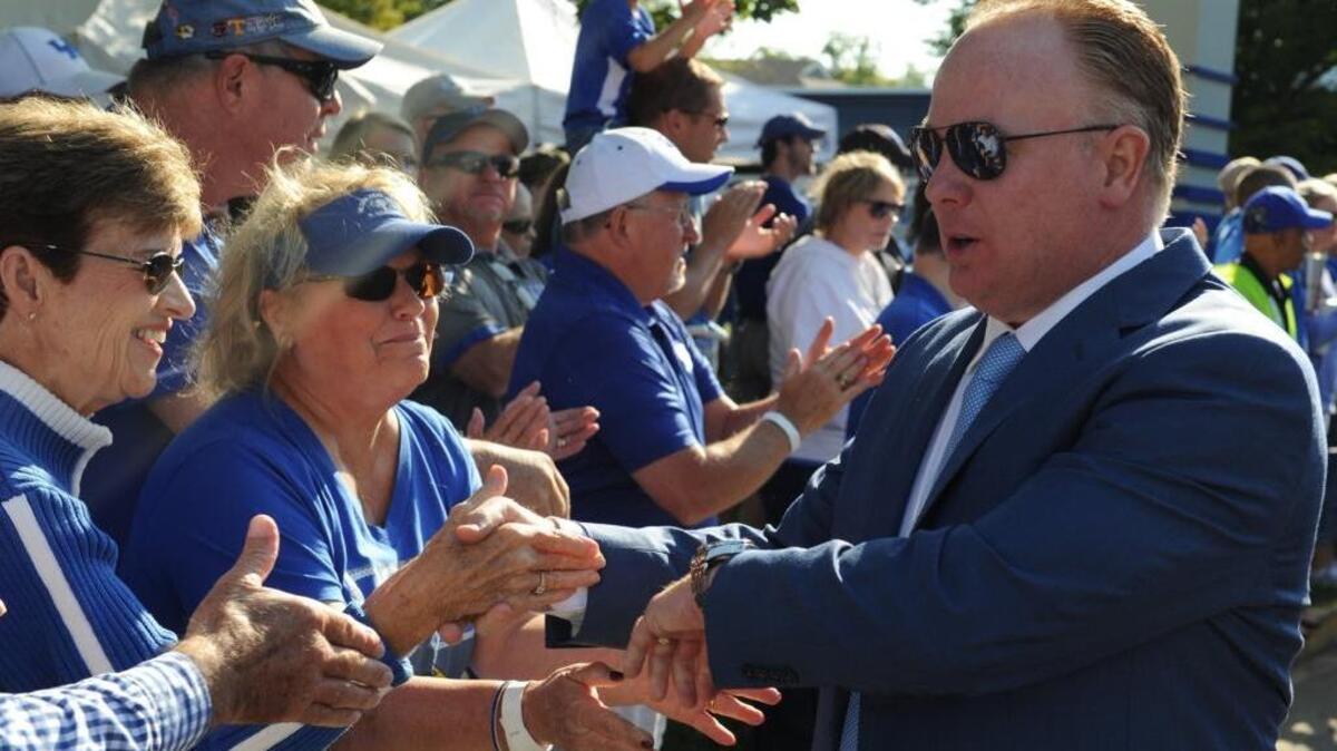UK head coach Mark Stoops greeted fans during the Cat Walk before the Wildcats’ game against Eastern Kentucky on Saturday.