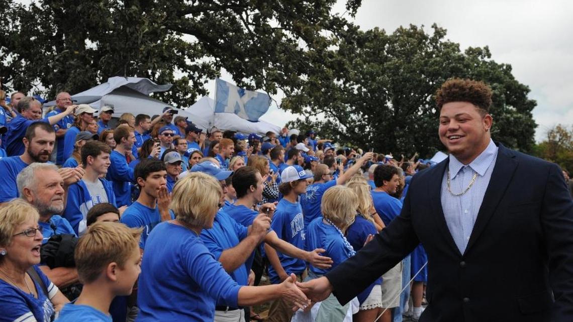 Matt Elam greeted fans during a Cat Walk at Commonwealth Stadium last season.