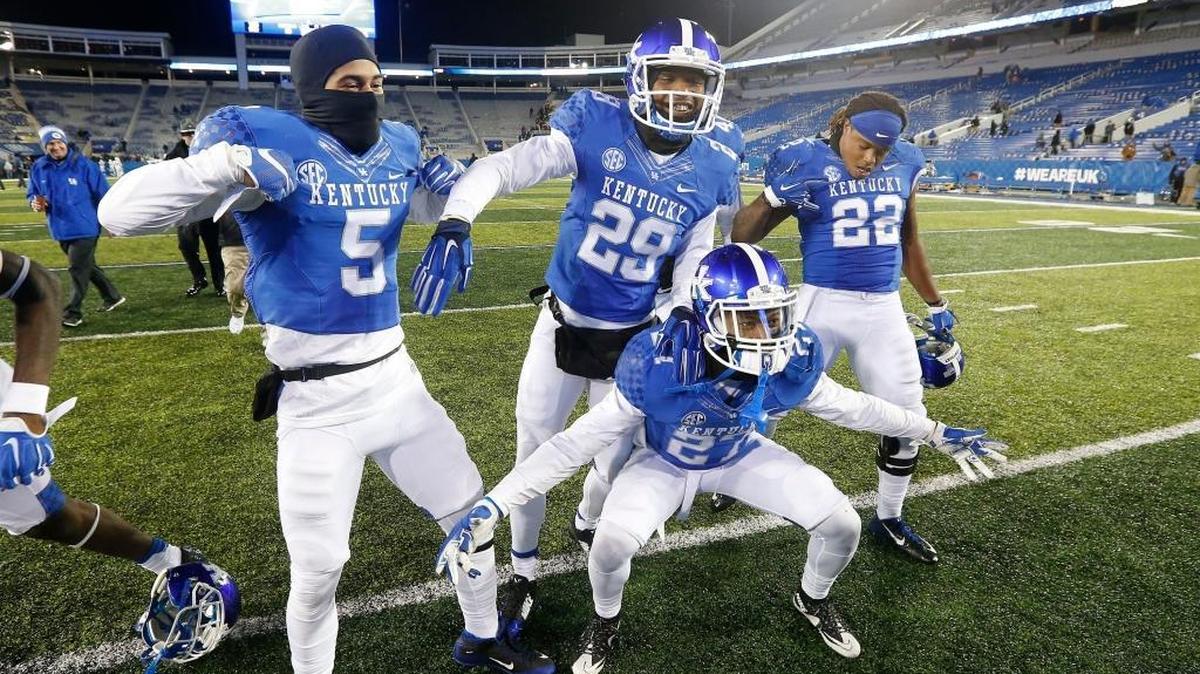 Kentucky cornerback Kendall Randolph (5), defensive back Derrick Baity (29), safety Mike Edwards (27) and linebacker Khalid Henderson (22) celebrated after UK beat Charlotte 58-10 last season.