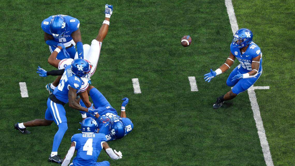 Defensive tackle Deone Walker, top left, delivered a hit that led to a Trevin Wallace interception on the first play UK defensive coordinator Brad White allowed him to drop into pass coverage.