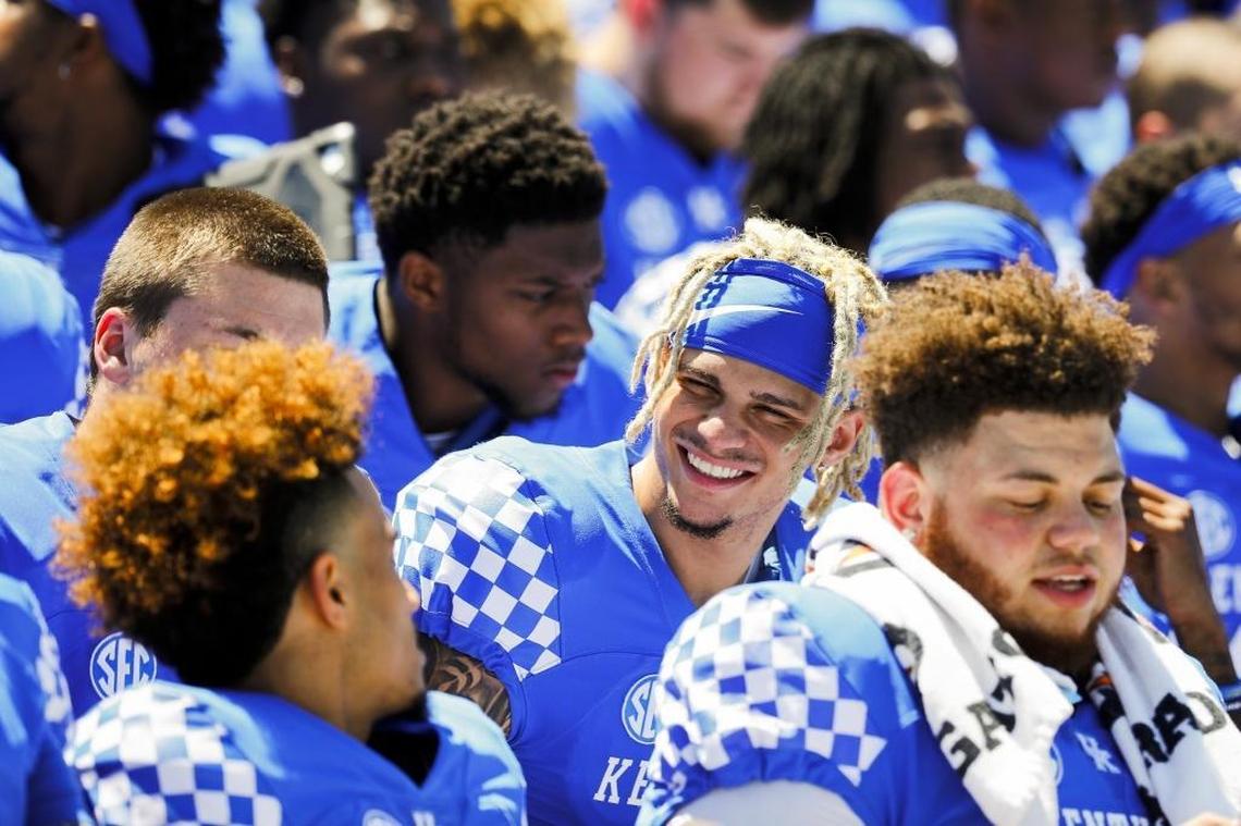 Kentucky wide receiver Blake Bone, center, joked with cornerback Kendall Randolph before the team photo at media day last Sunday.