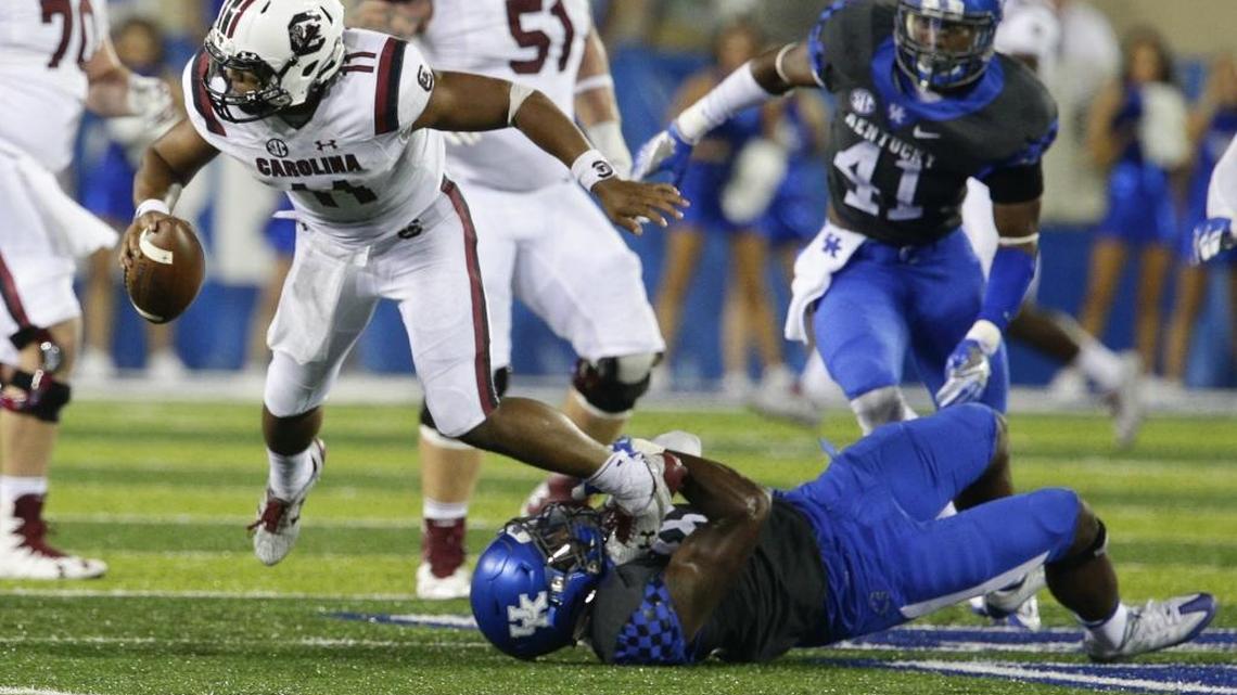 Kentucky defensive end Denzil Ware (35) made a fourth-down sack on South Carolina quarterback Brandon McIlwain on Saturday, Sept. 24, 2016, in Lexington.