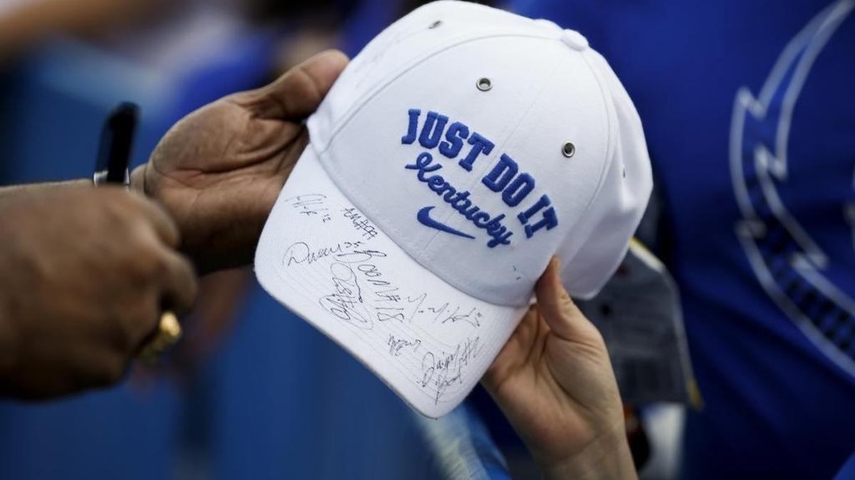 A fan got his Kentucky hat autographed by several UK football players and coaches at fan day earlier this month.