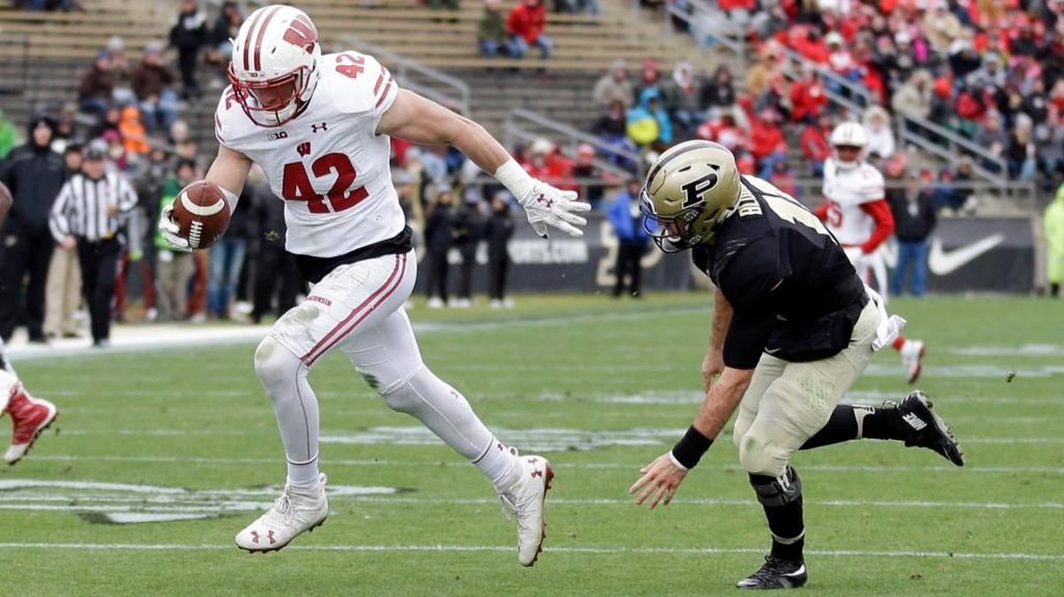 Wisconsin linebacker T.J. Watt (42) returns an interception for a touchdown past Purdue quarterback David Blough (11) during the first half in West Lafayette, Ind., on Saturday.
