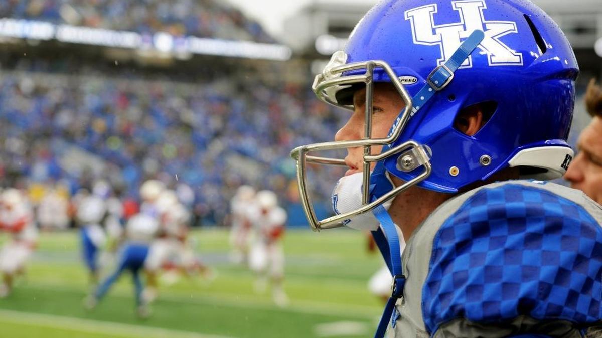 UK quarterback Drew Barker watched the opening kickoff of the Kentucky-Louisville football game at Commonwealth Stadium on Saturday, Nov. 28, 2015.