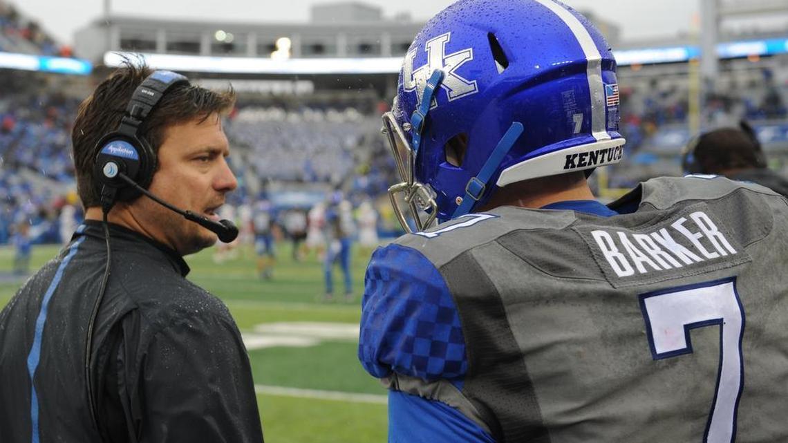 Offensive coordinator Shannon Dawson, out after one season at Kentucky, instructed quarterback Drew Barker during the first quarter of the UK-Louisville game last month at Commonwealth Stadium.