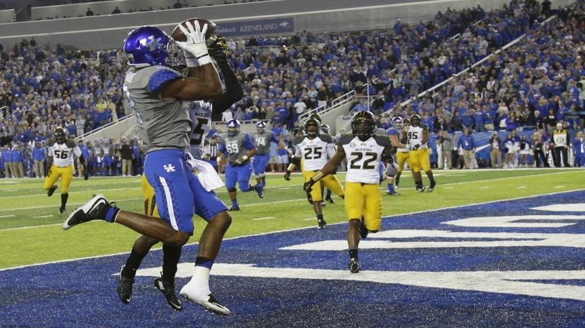 Kentucky wide receiver Dorian Baker (2) scored a fourth-quarter touchdown over Missouri cornerback John Gibson (5) on Sept. 26, 2015, in Lexington.