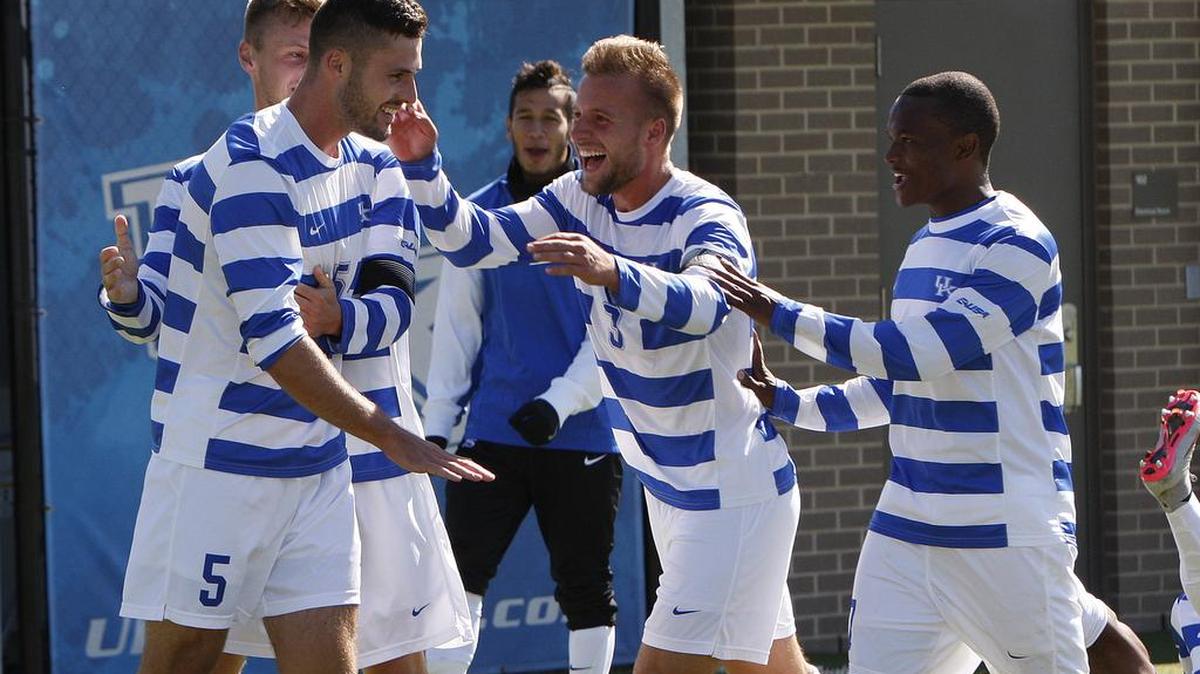UK players celebrate the goal by Jordan Wilson, left, against South Carolina at the Bell Soccer Complex at UK in Lexington, Ky., Sunday, October 18, 2015. UK defeated South Carolina 1-0.