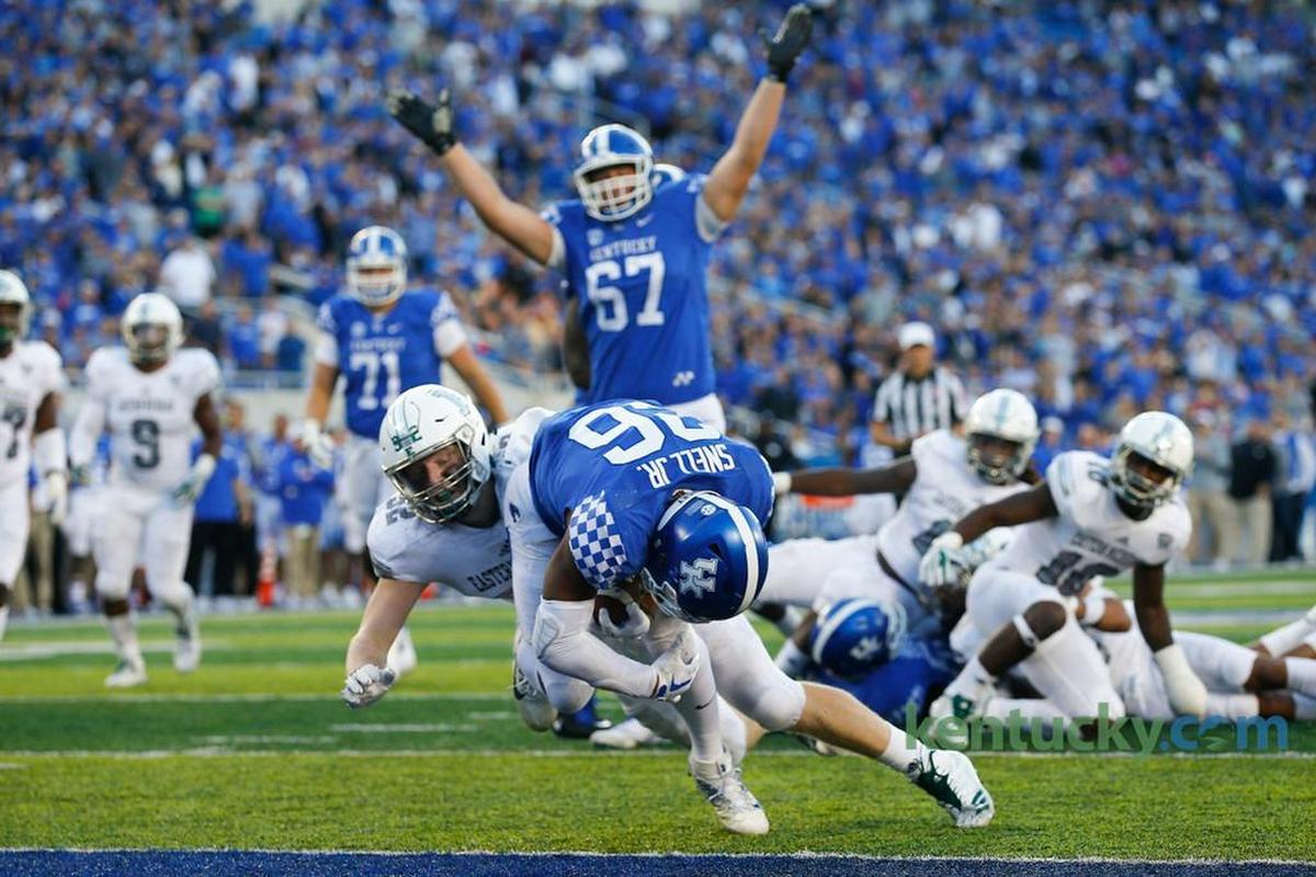 Kentucky offensive tackle Landon Young (67) celebrated as running back Benny Snell (26) scored a touchdown in UK’s 24-20 victory over Eastern Michigan at Kroger Field last season.