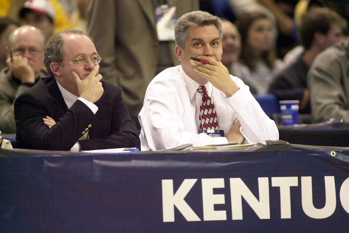 Lexington Herald-leader columnists John Clay, left, and Mark Story, right, watch Kentucky basketball play Marquette in an NCAA Tournament Midwest Regional game in Minneapolis on March 29, 2003.
