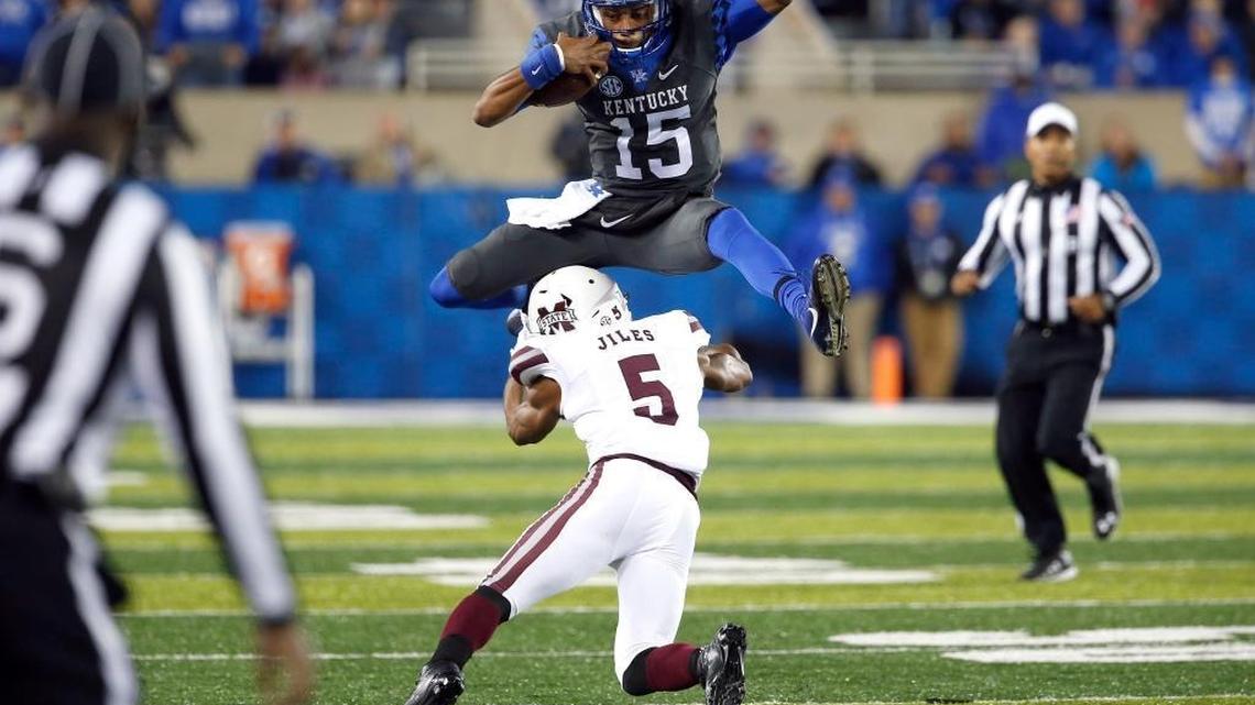 Kentucky quarterback Stephen Johnson hurdled Mississippi State defensive back Cedric Jiles during UK’s win Oct. 8 at Commonwealth Stadium. Johnson led the Wildcats to wins in seven of their last 10 games this season.