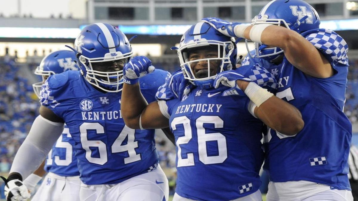UK freshman running back Benny Snell Jr. celebrated scoring his fourth touchdown early in the fourth quarter against New Mexico State at Commonwealth Stadium on Sept. 17, 2016.