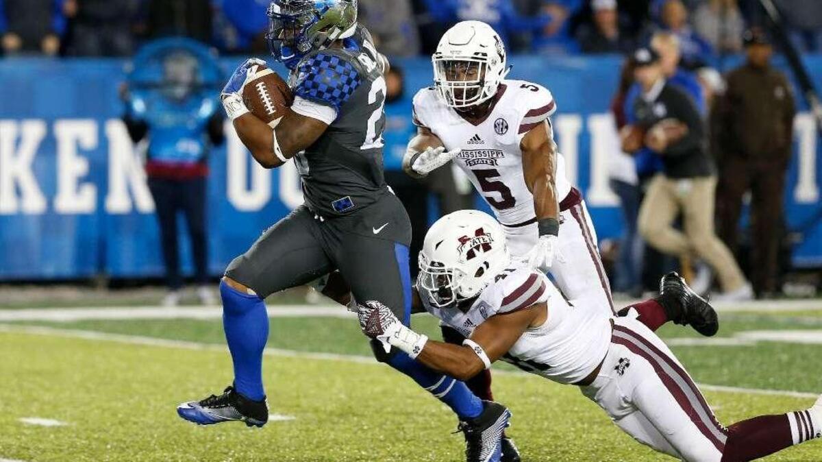 Kentucky freshman Benny Snell broke away from two Mississippi State defenders en route to a 34-yard touchdown run. A 5-foot-11, 220-pound product of Westerville, Ohio, Snell finished with 128 yards rushing against the Bulldogs.