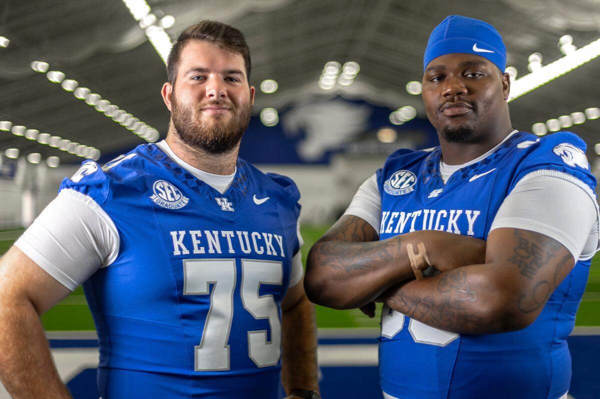 Center Eli Cox (75) and left tackle Marques Cox (69) are expected to anchor a veteran offensive line facing pressure to improve for Kentucky football in 2024.