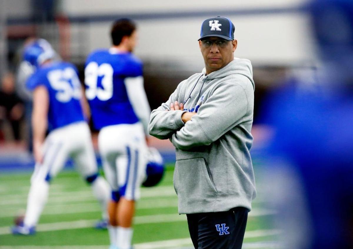 Kentucky’s wide receivers, including walk-on turned camp champ David Bouvier, are being coached by new position coach Michael Smith.