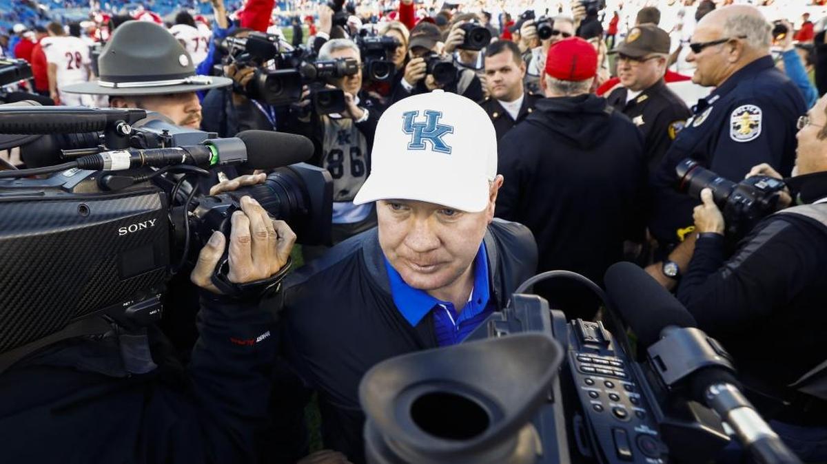 Mark Stoops left the field after Kentucky’s loss to Louisville in Lexington. Stoops’ Wildcats finished the regular season 7-5 for the second year in a row and now wait to learn their bowl destination.